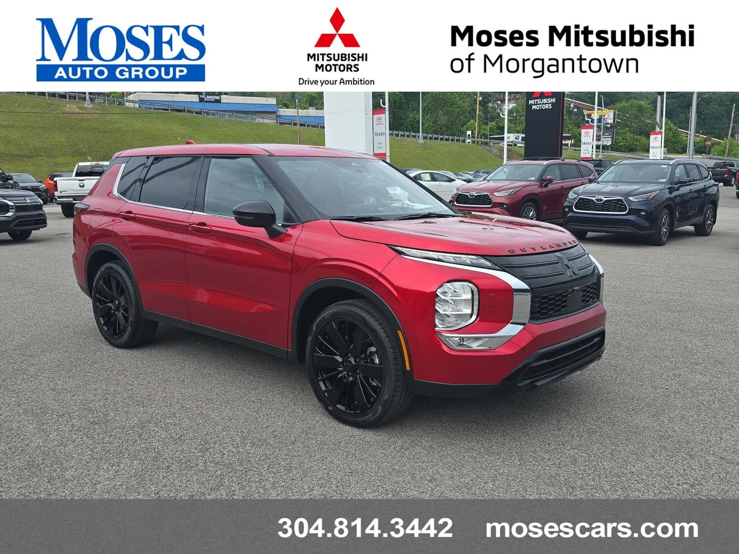 2026 Mitsubishi Outlander LE in Red Diamond — front three-quarter view