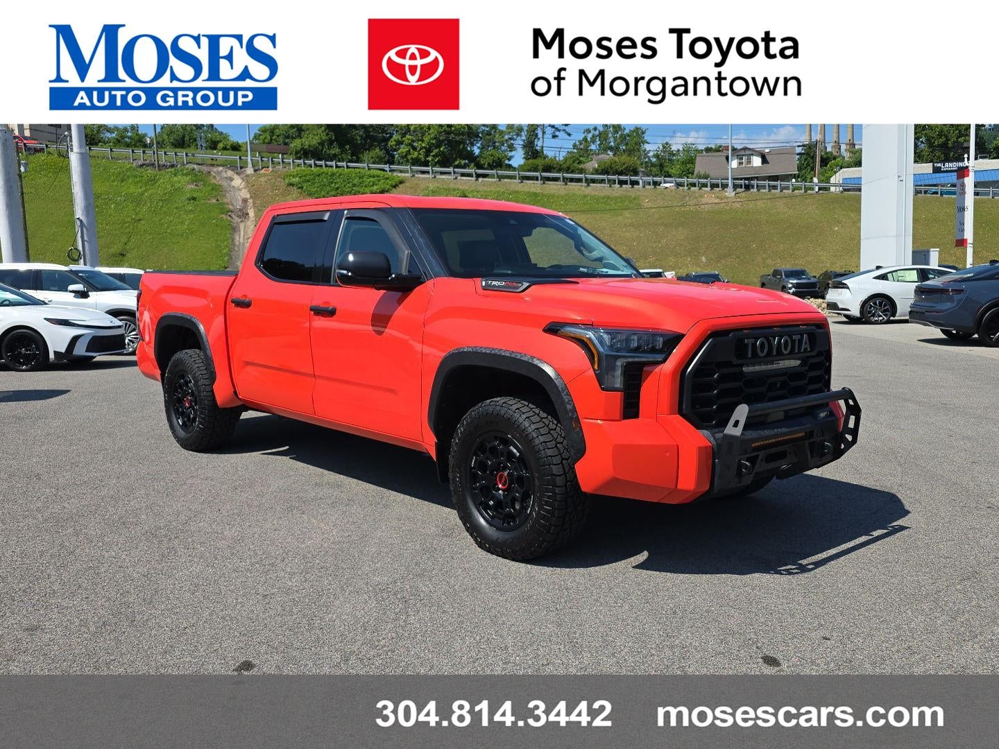 2022 Toyota Tundra TRD Pro HV in Solar Octane — front three-quarter view