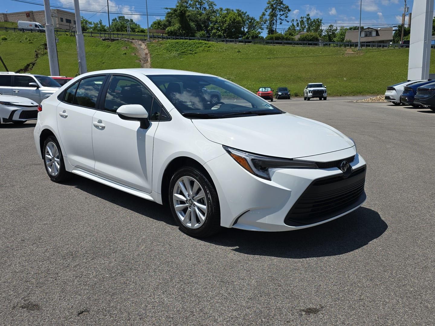 2026 Toyota Corolla Hybrid LE in Ice Cap — front three-quarter view